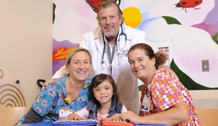 Pediatric patient with nurses and physician