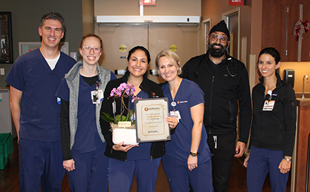 Adelita Cheadle posing with Department after Guardian Angel recognition