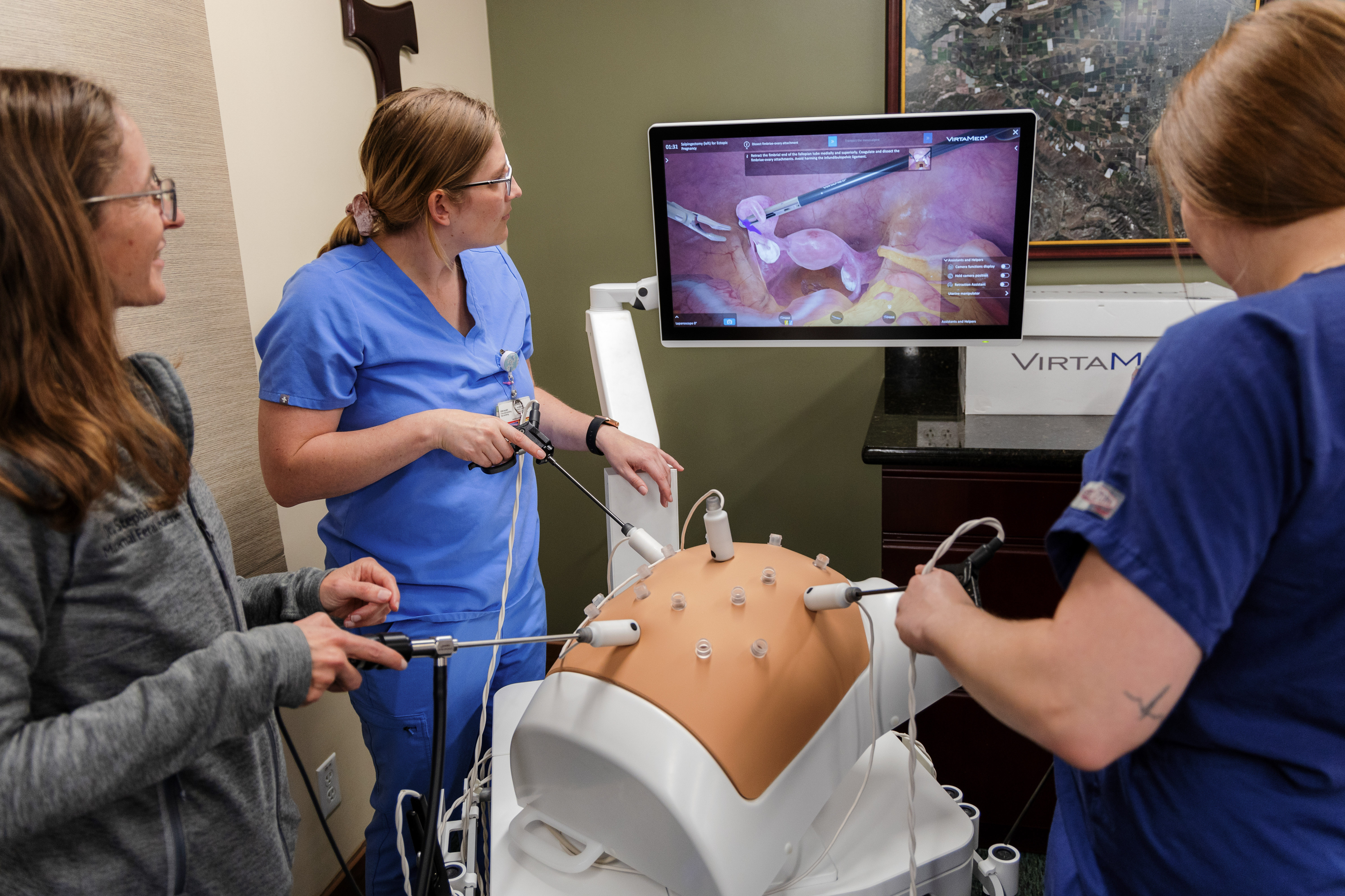 Physicians Working on Practice Birthing Tools