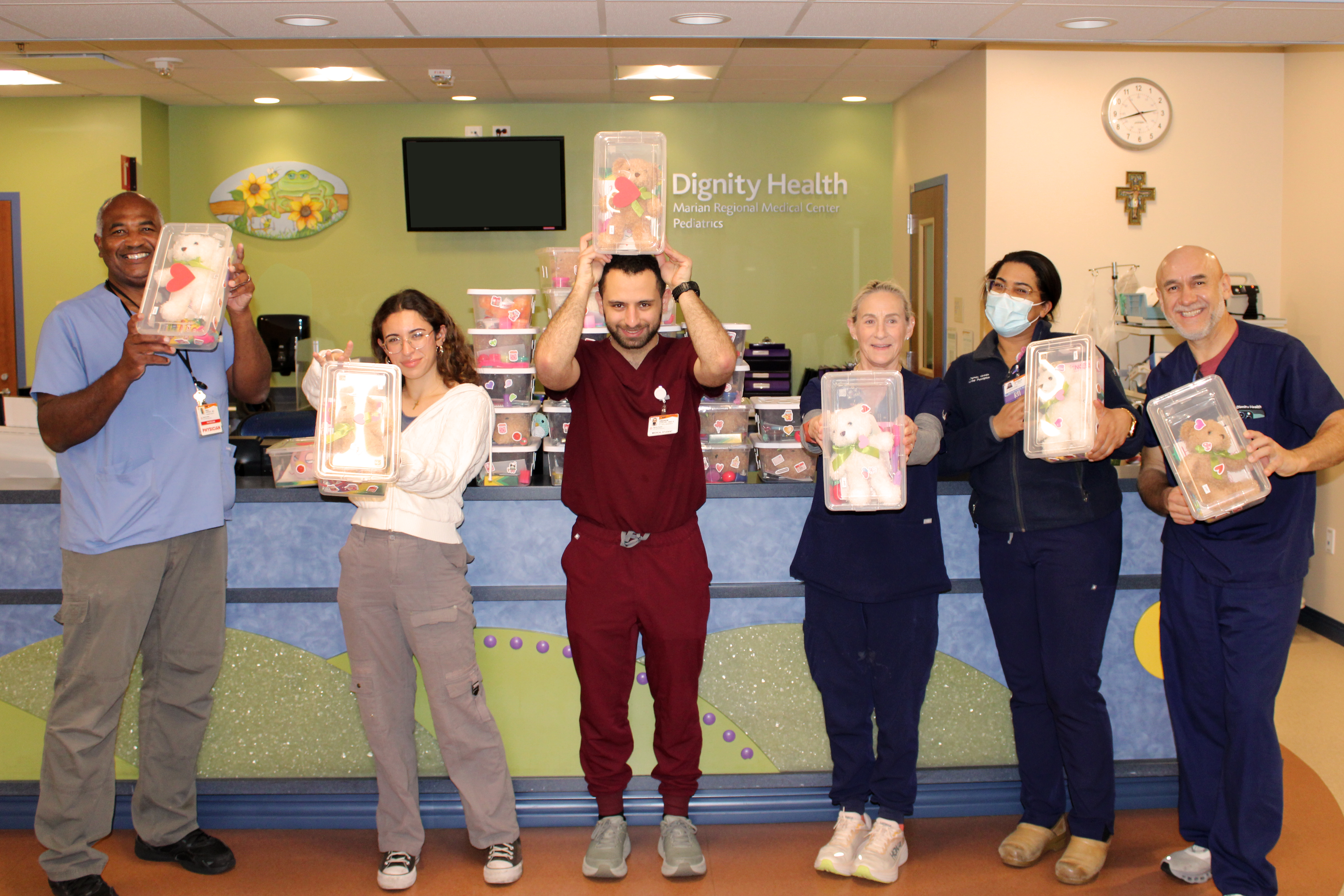 Group posting with donated childrens gifts