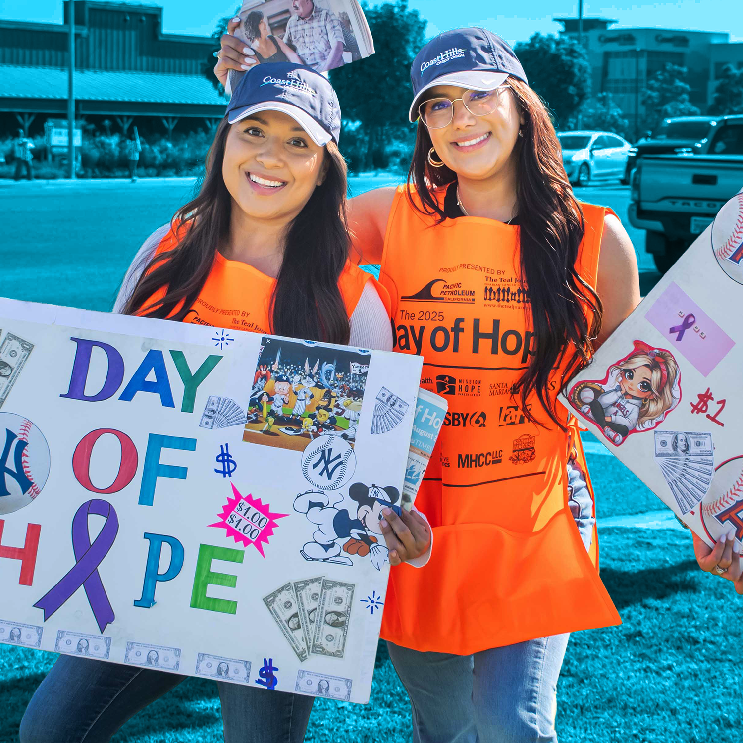Day of Hope duo fundraising with signs