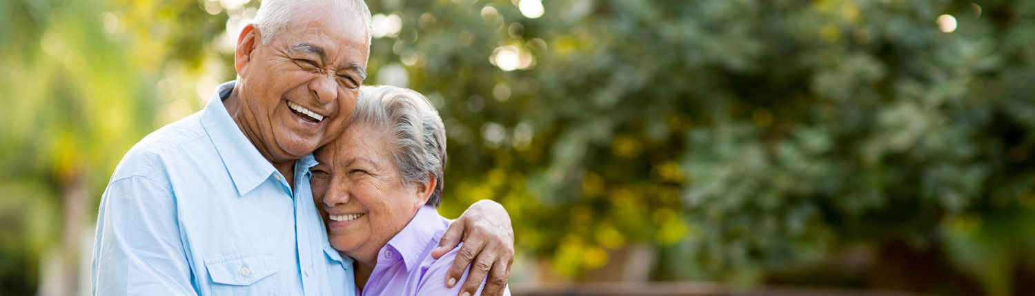 senior couple hugging and laughing